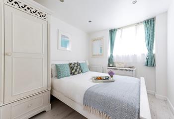 This seaside themed bedroom is the perfect place to come back to after a day out exploring St Ives. 