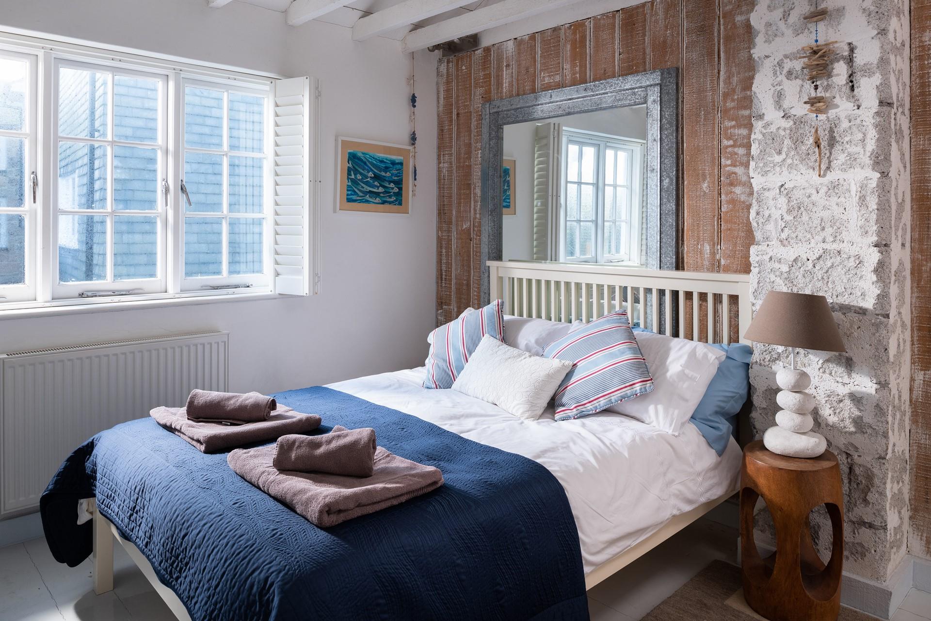 Settle into bed after spending the evening sitting on the beach watching the sun go down.