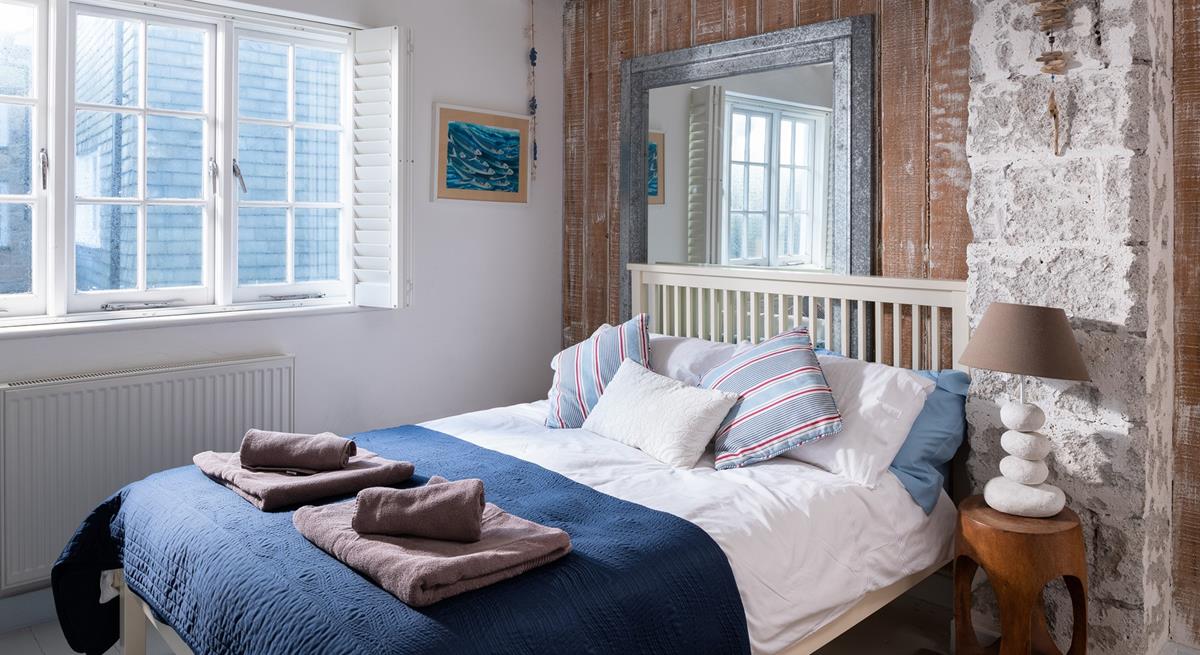 Settle into bed after spending the evening sitting on the beach watching the sun go down.