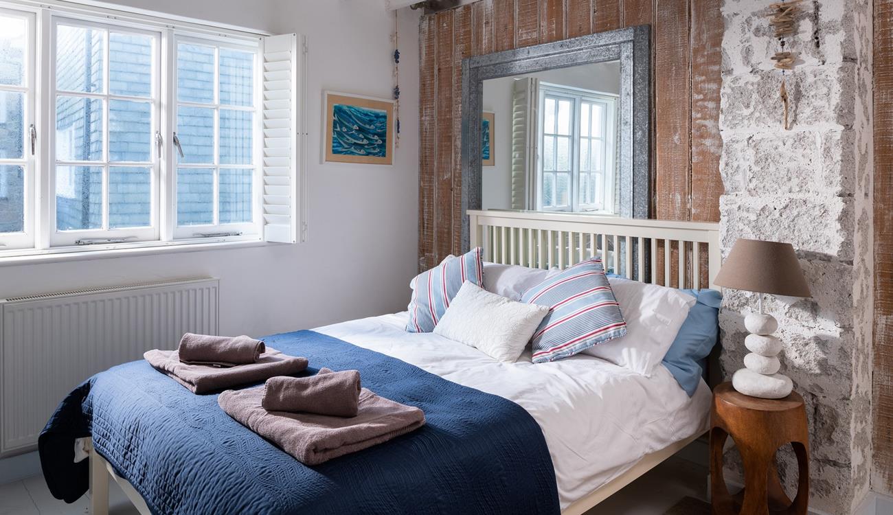 Settle into bed after spending the evening sitting on the beach watching the sun go down.