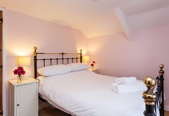 Warm and inviting, sink into the sumptuous king size bed in Bedroom 3. 