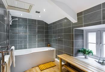 Stylish and luxurious, the family bathroom has been beautifully finished and features a bath with shower.