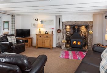 Light the fire, pour a glass of wine and unwind together in the cosy sitting room. 