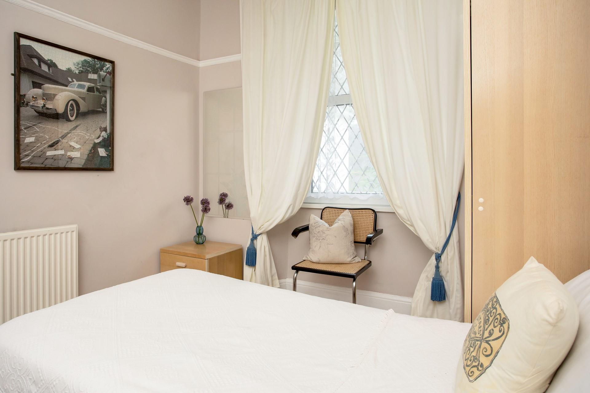 A cosy chair in the twin room offers a wonderful spot for parents to read bedtime stories.