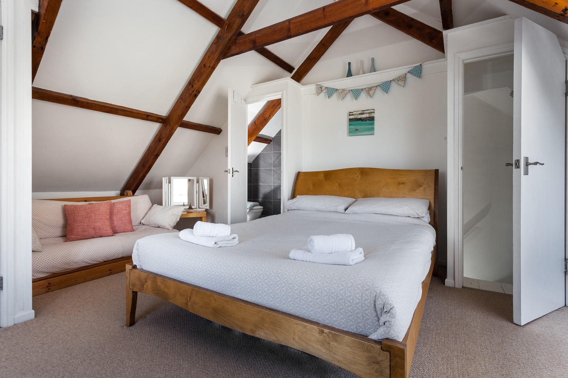 Bedroom 4 has a king size bed and an en suite and is located in the loft area.