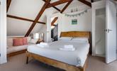 Bedroom 4 has a king size bed and an en suite and is located in the loft area. - Thumbnail Image