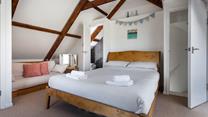 Bedroom 4 has a king size bed and an en suite and is located in the loft area.