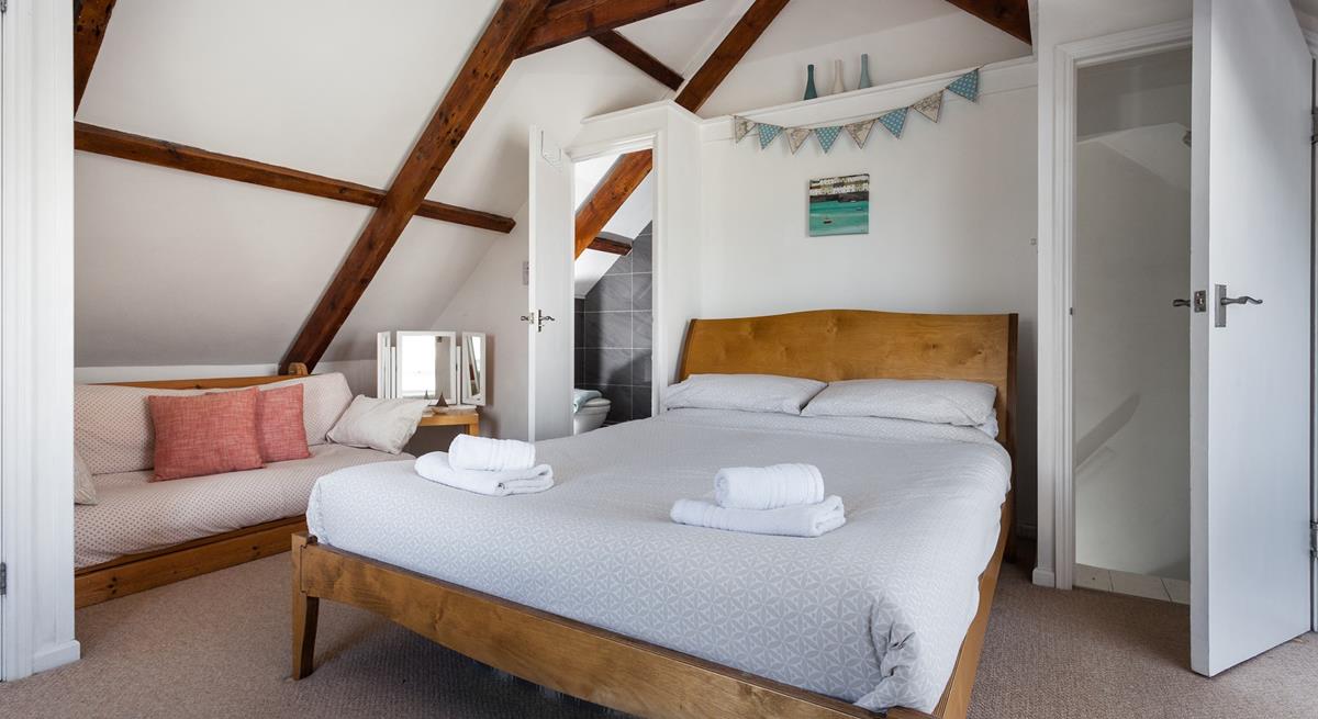 Bedroom 4 has a king size bed and an en suite and is located in the loft area.