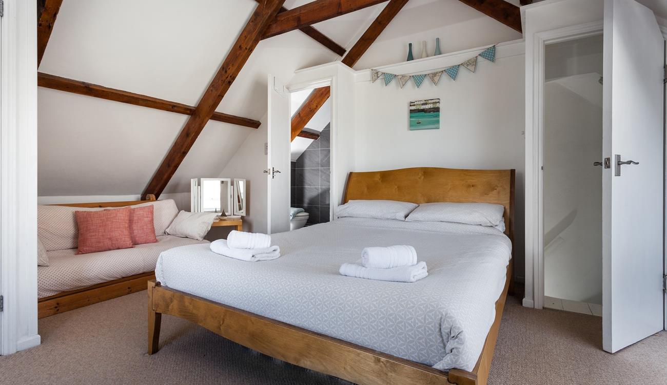 Bedroom 4 has a king size bed and an en suite and is located in the loft area.