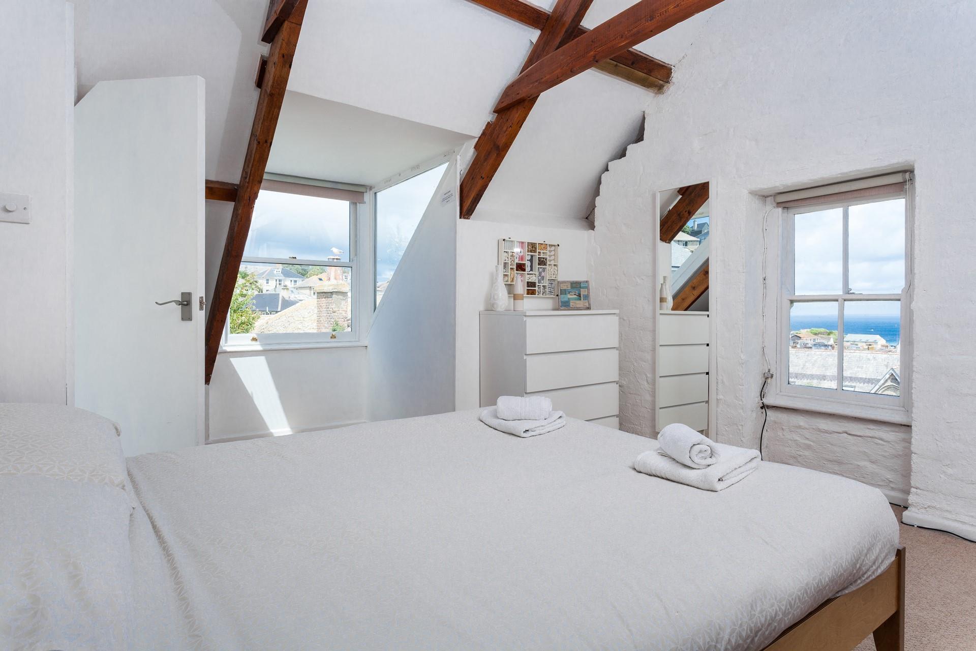 Wake up to sea glimpses from bedroom 4's window.