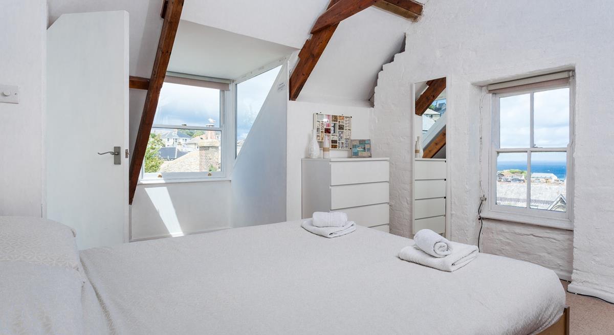 Wake up to sea glimpses from bedroom 4's window.