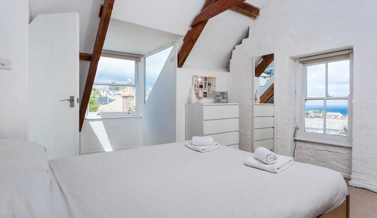 Wake up to sea glimpses from bedroom 4's window.