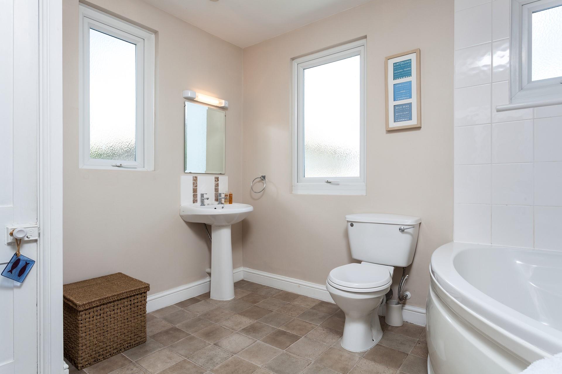 A spacious family bathroom makes for a relaxing stay.