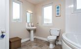 A spacious family bathroom makes for a relaxing stay. - Thumbnail Image