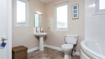 A spacious family bathroom makes for a relaxing stay.