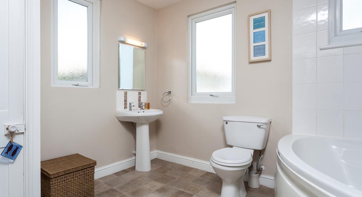 A spacious family bathroom makes for a relaxing stay.