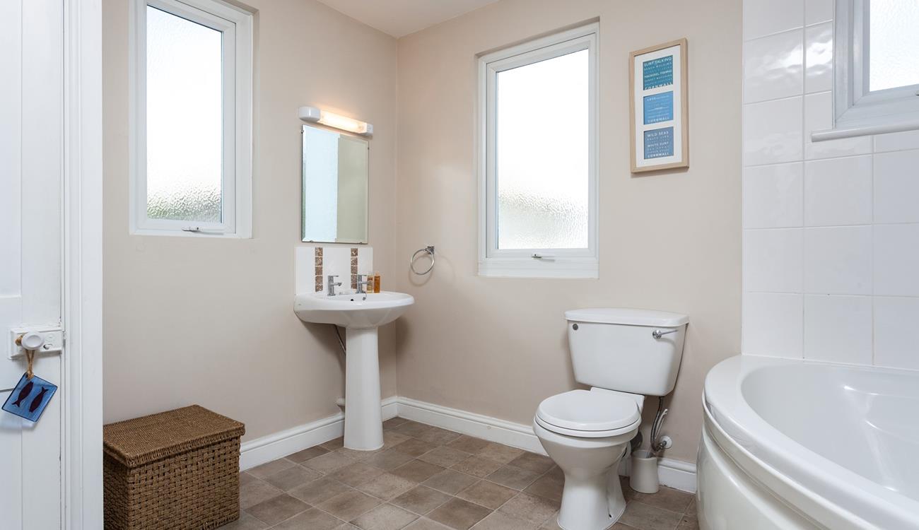 A spacious family bathroom makes for a relaxing stay.