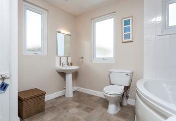 A spacious family bathroom makes for a relaxing stay.