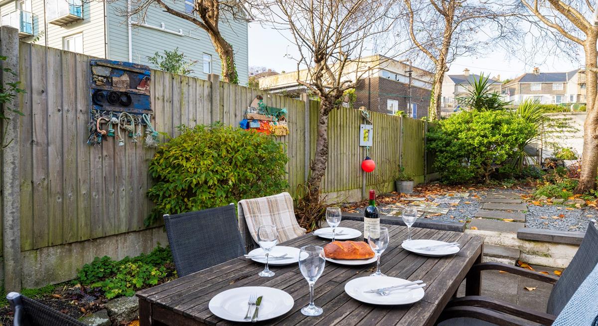 Spend your evenings indulging in al fresco meals in the sun trap garden.