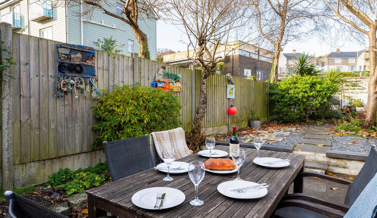 Spend your evenings indulging in al fresco meals in the sun trap garden.