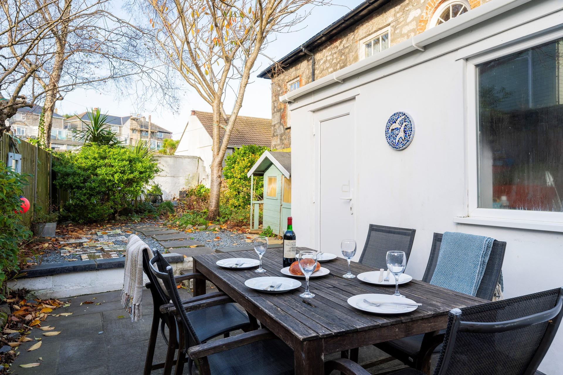 The enclosed garden to the rear of the property is the perfect space for a sunny evening barbeque.