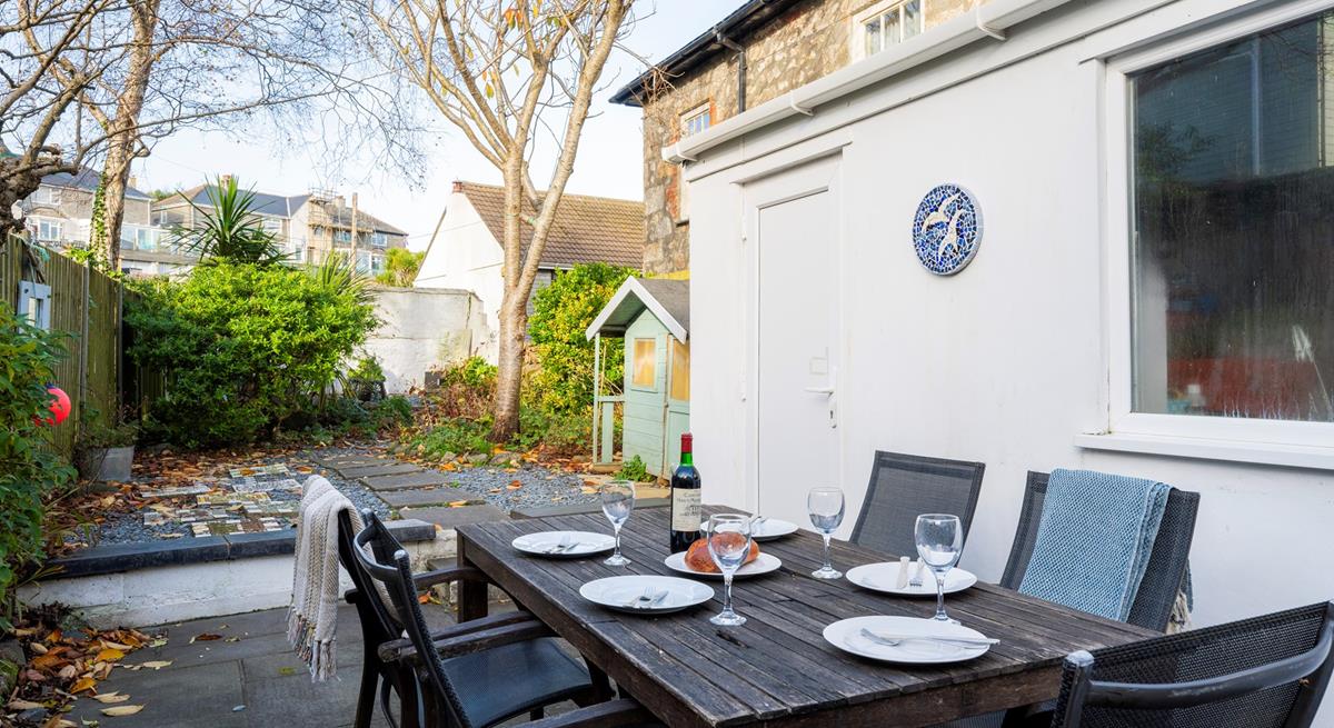 The enclosed garden to the rear of the property is the perfect space for a sunny evening barbeque.