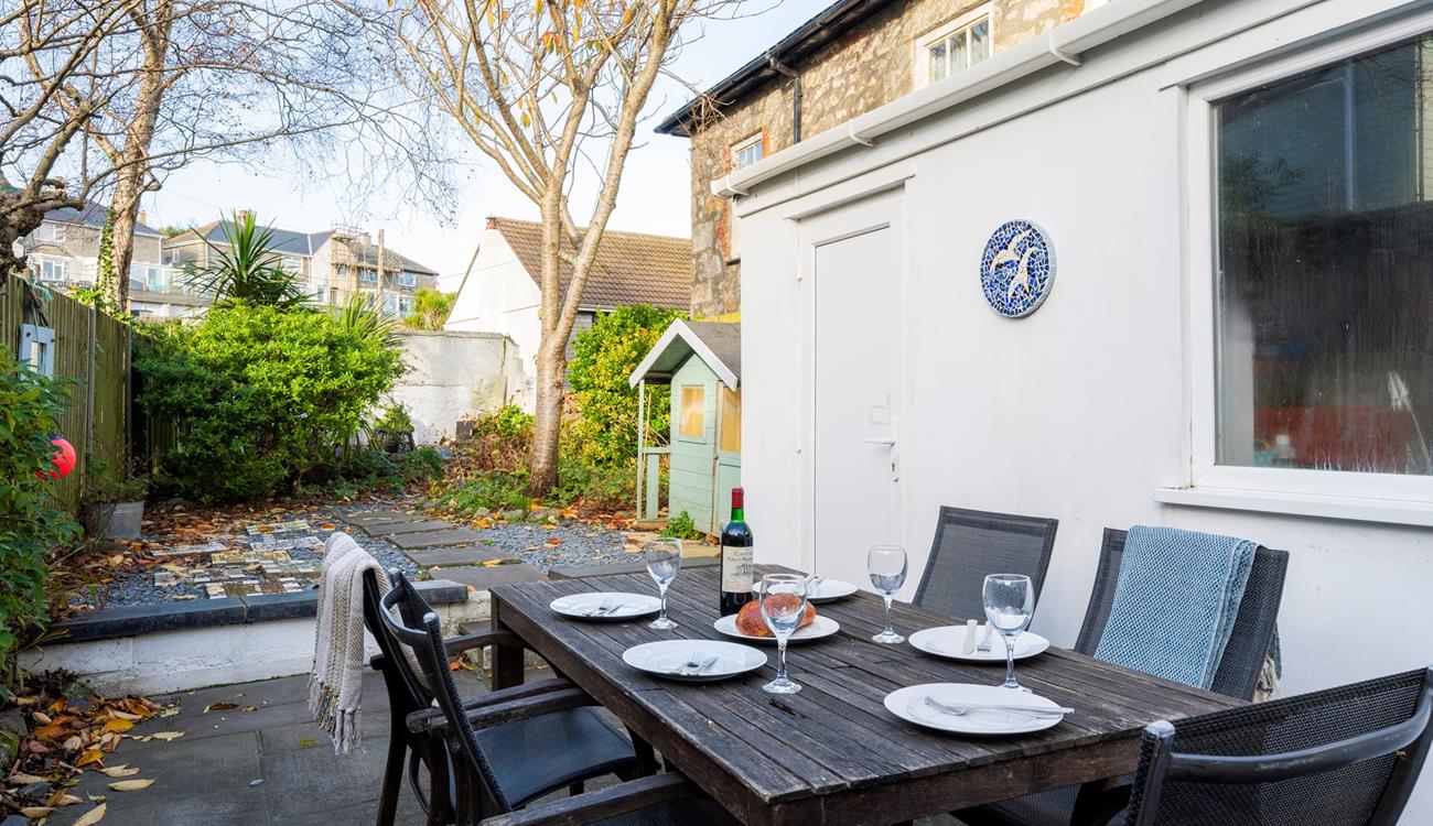 The enclosed garden to the rear of the property is the perfect space for a sunny evening barbeque.