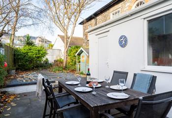 The enclosed garden to the rear of the property is the perfect space for a sunny evening barbeque.