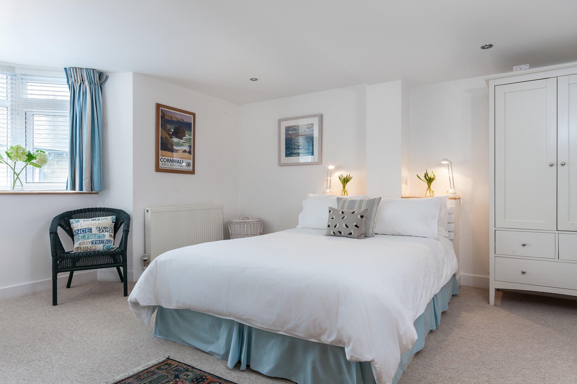 Bedroom 1 is wonderfully spacious with homely decor and ample room for all your holiday outfits!