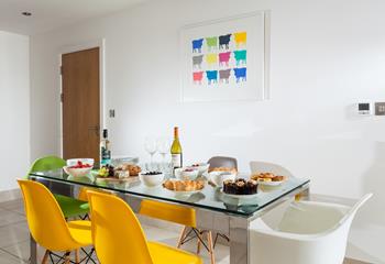 The dining table has ample space for everyone to enjoy a hearty breakfast.