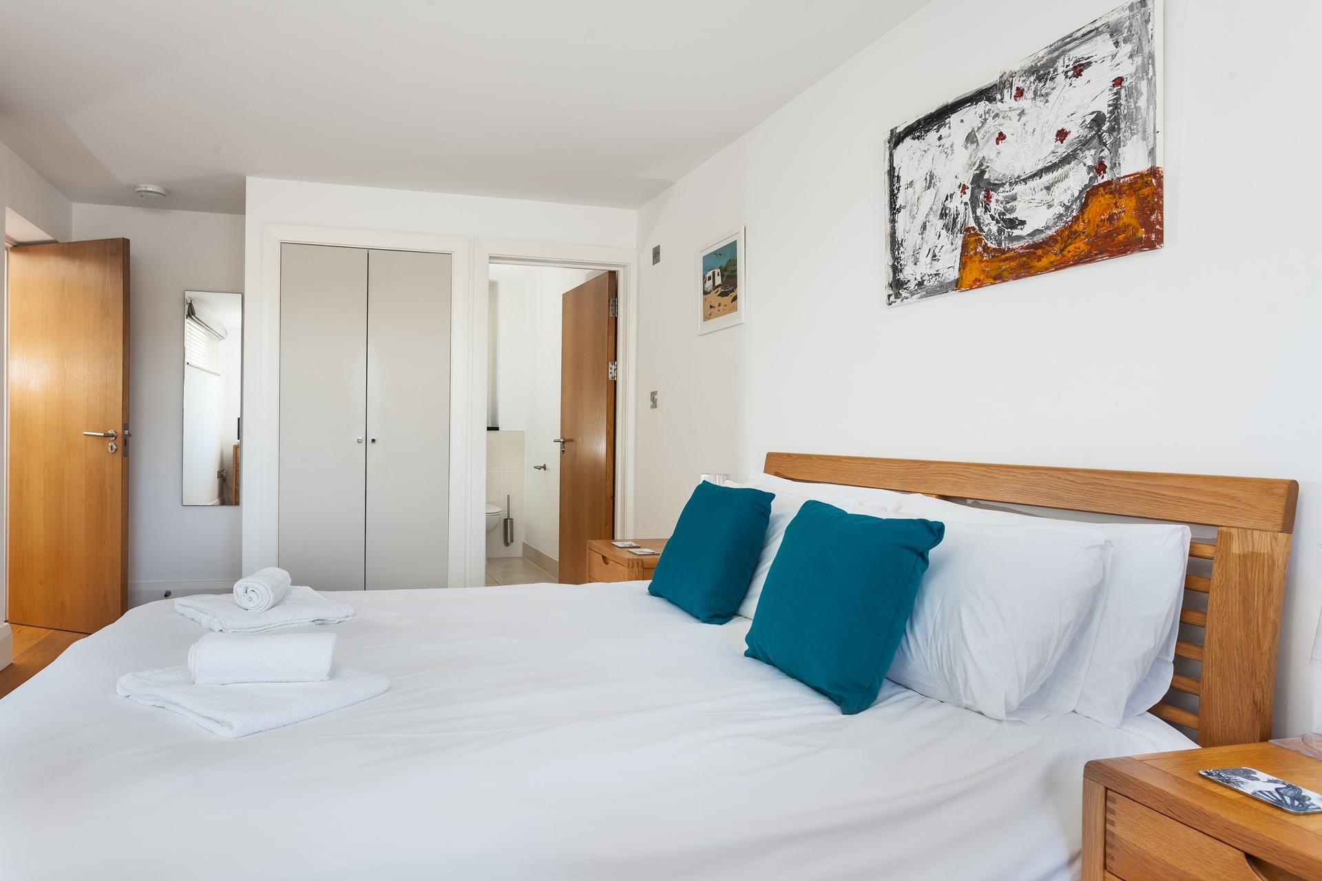 The spacious king size bed offers you a peaceful night's sleep.