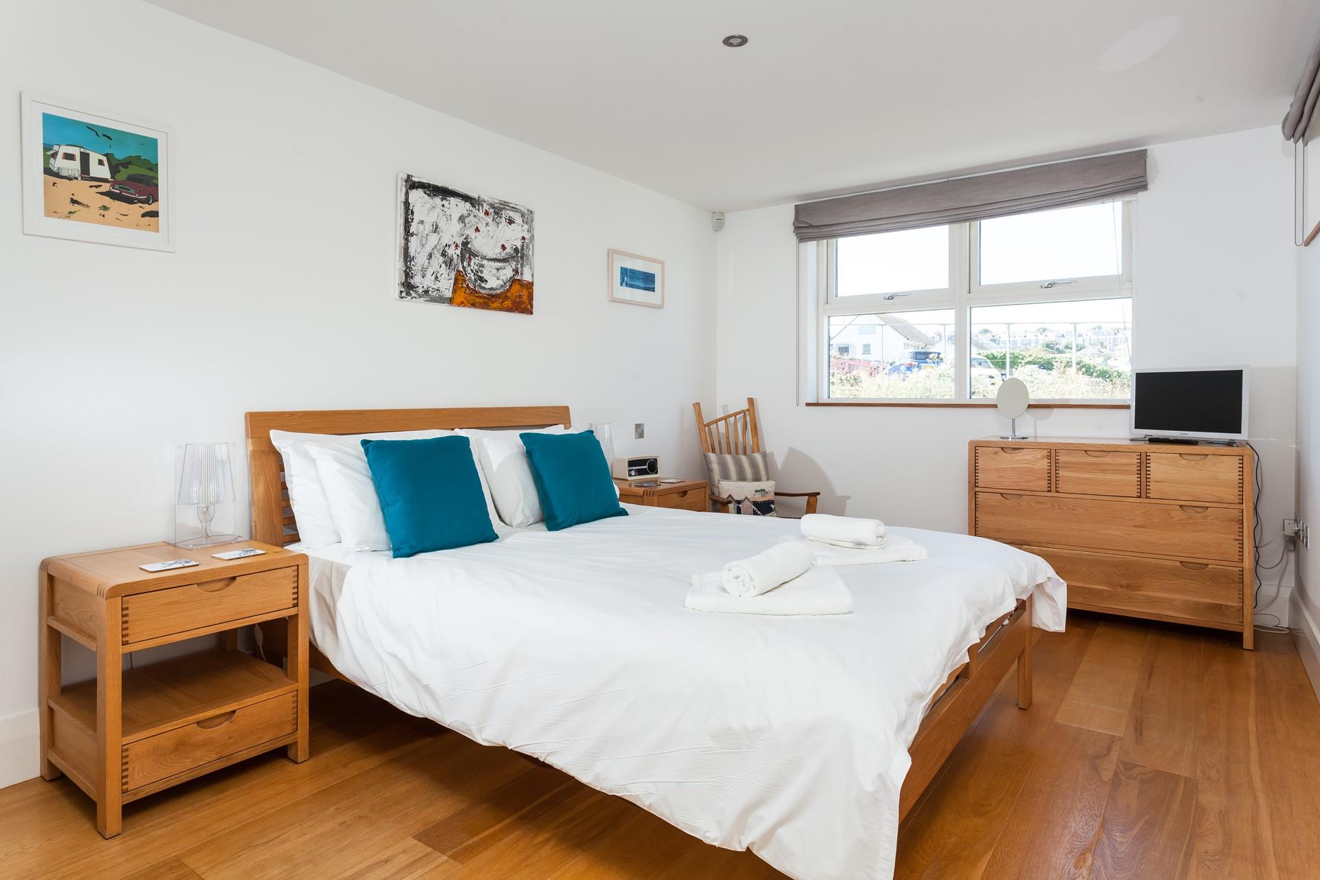 Soft sheets and fluffy towels await you in this apartment.