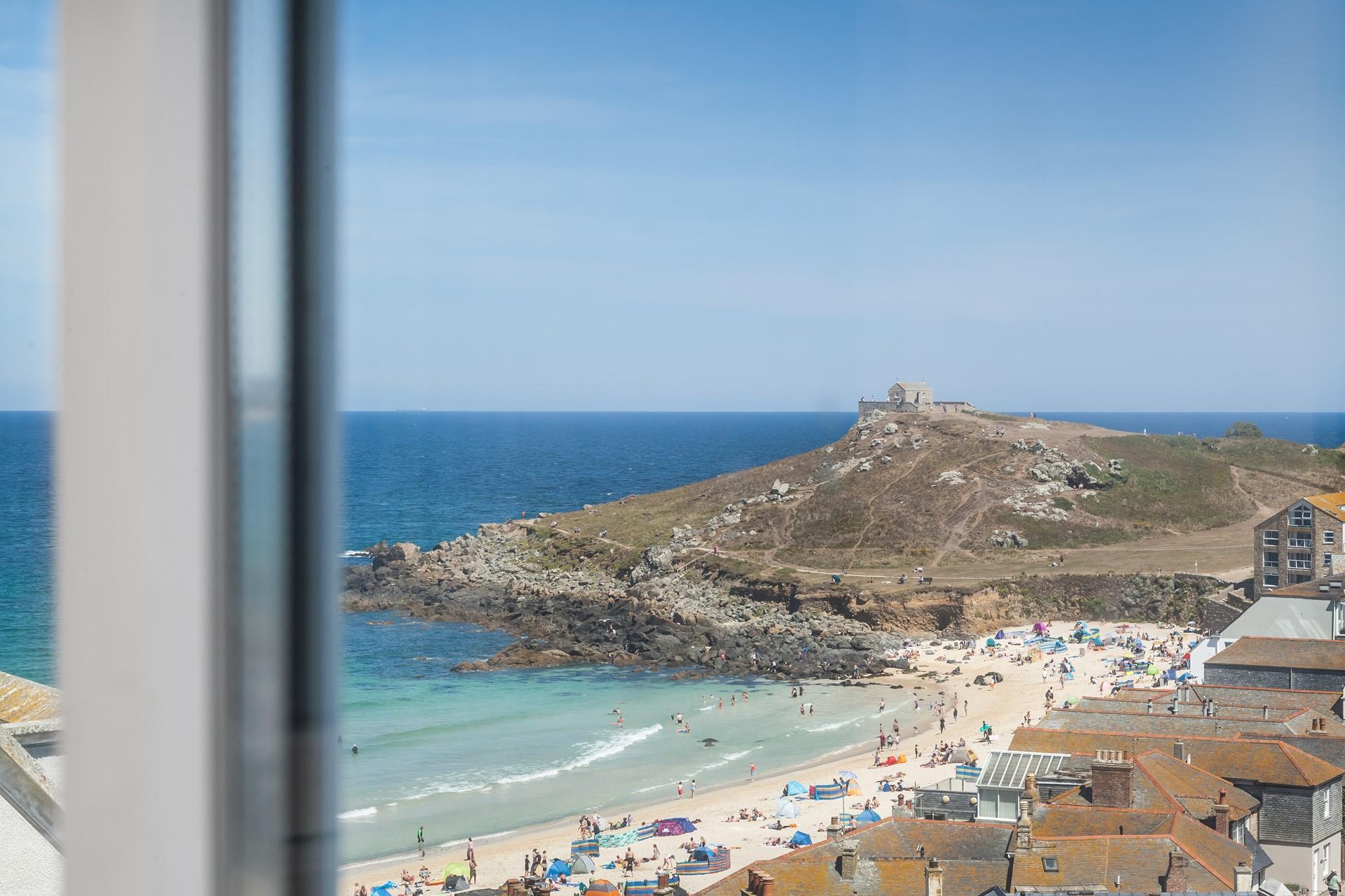 Commanding views of the turquoise waters and soft white sand of Porthmeor.