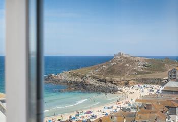 Commanding views of the turquoise waters and soft white sand of Porthmeor.