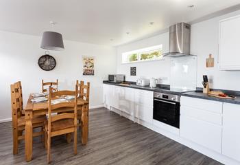 The modern well-equipped kitchen is perfect for the chef of the family to cook up a storm.