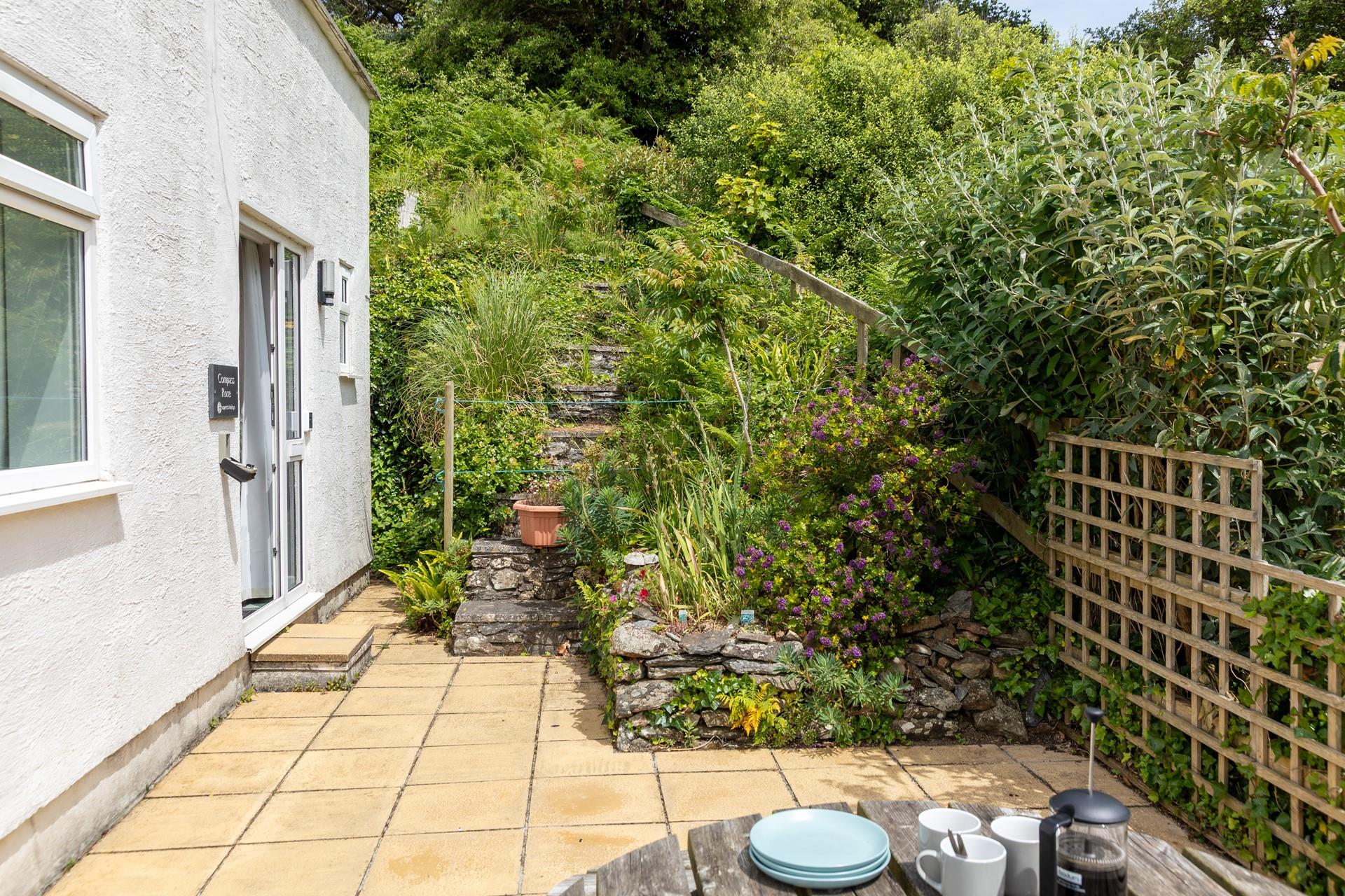 The patio is lovely spot for an afternoon coffee.