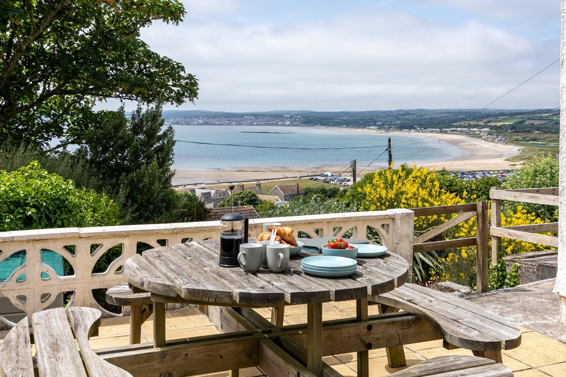Sit on the sun terrace and enjoy breakfast with a sea view.