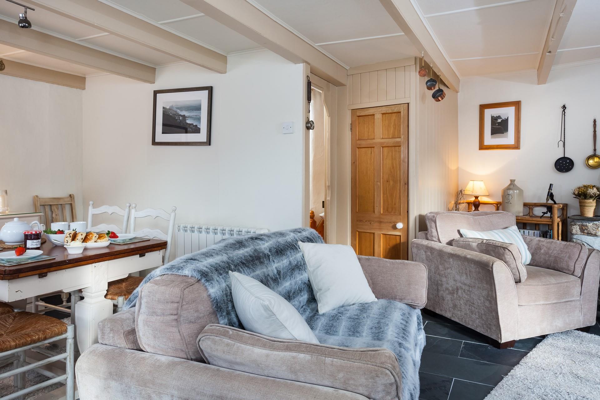 Relax and unwind on the comfy sofa in front of the woodburner.