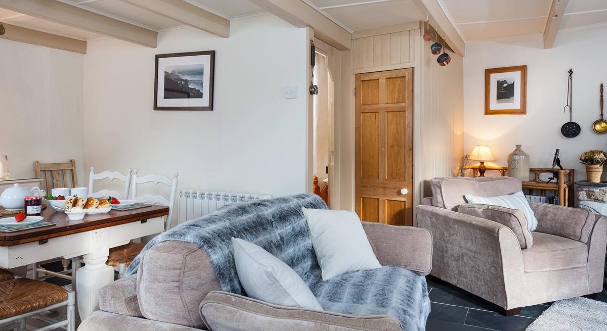 Relax and unwind on the comfy sofa in front of the woodburner.