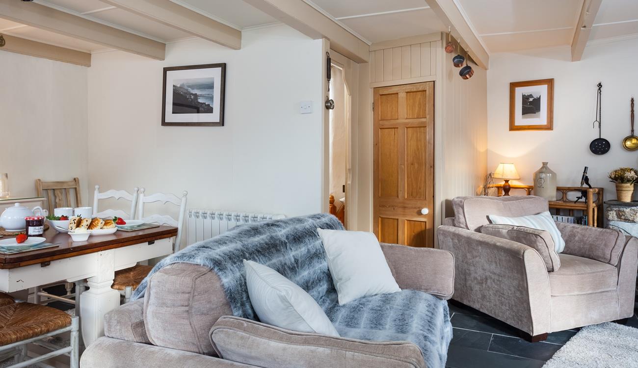 Relax and unwind on the comfy sofa in front of the woodburner.