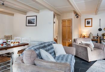 Relax and unwind on the comfy sofa in front of the woodburner.