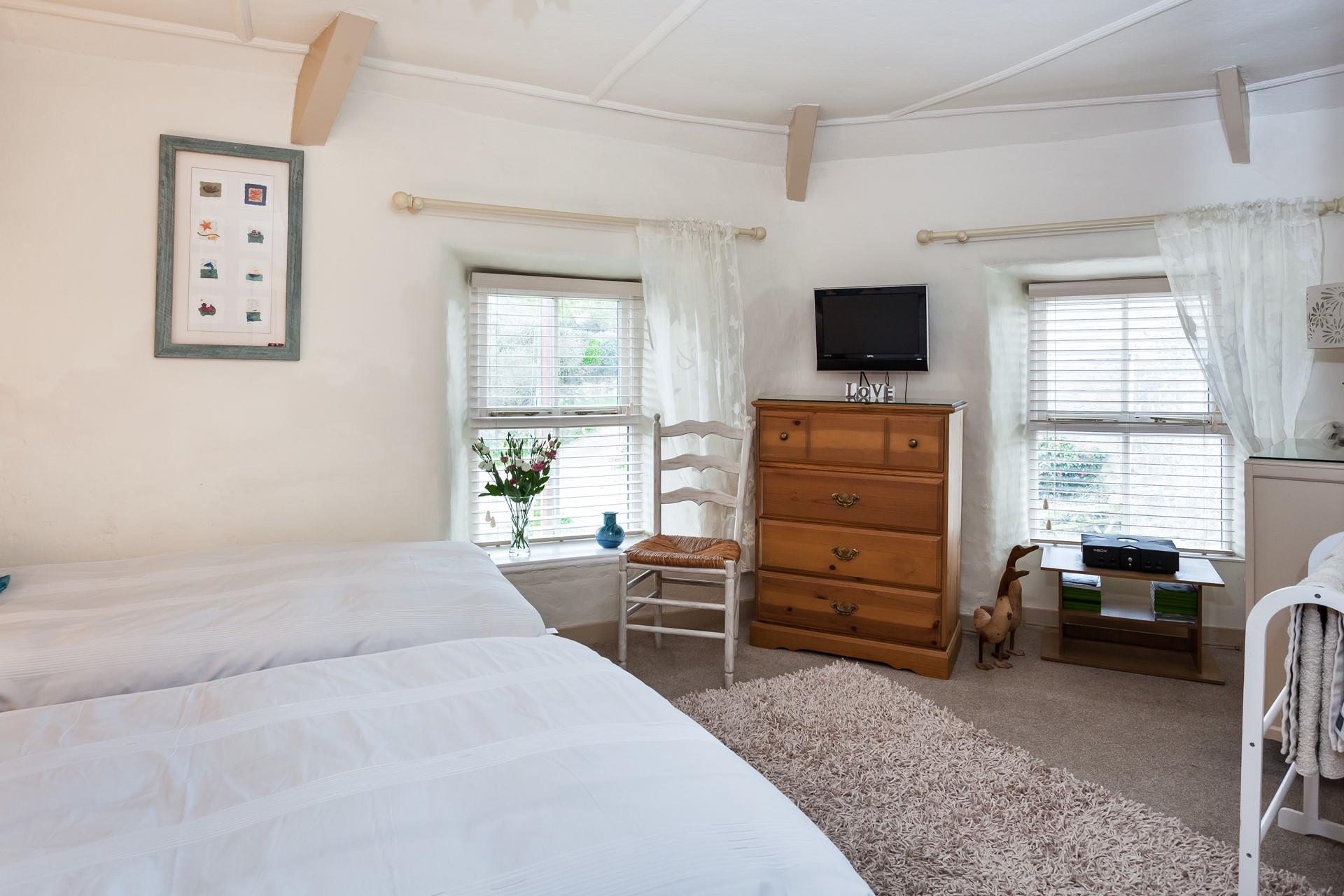 There is ample space in the dual-aspect, twin bedroom.