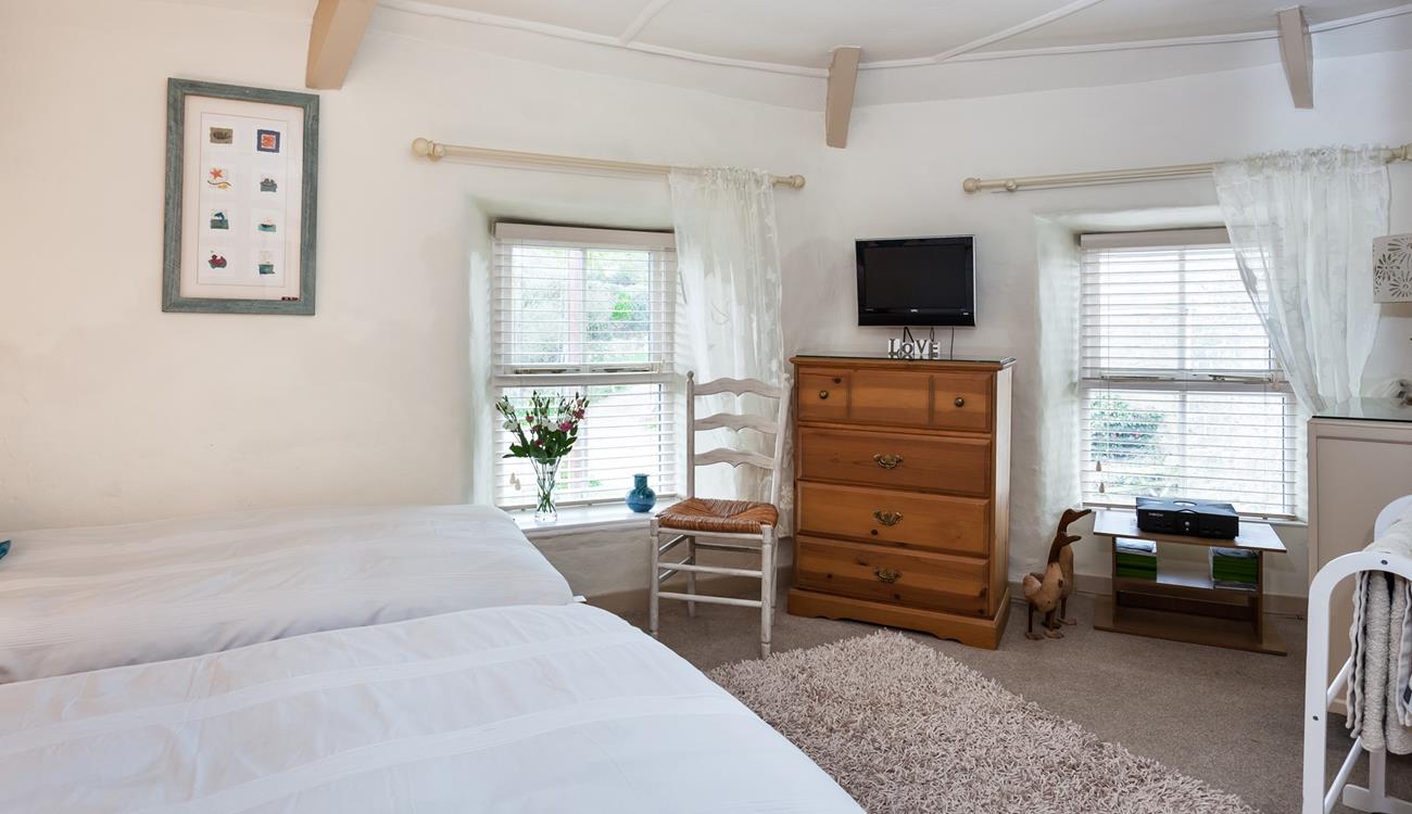 There is ample space in the dual-aspect, twin bedroom.