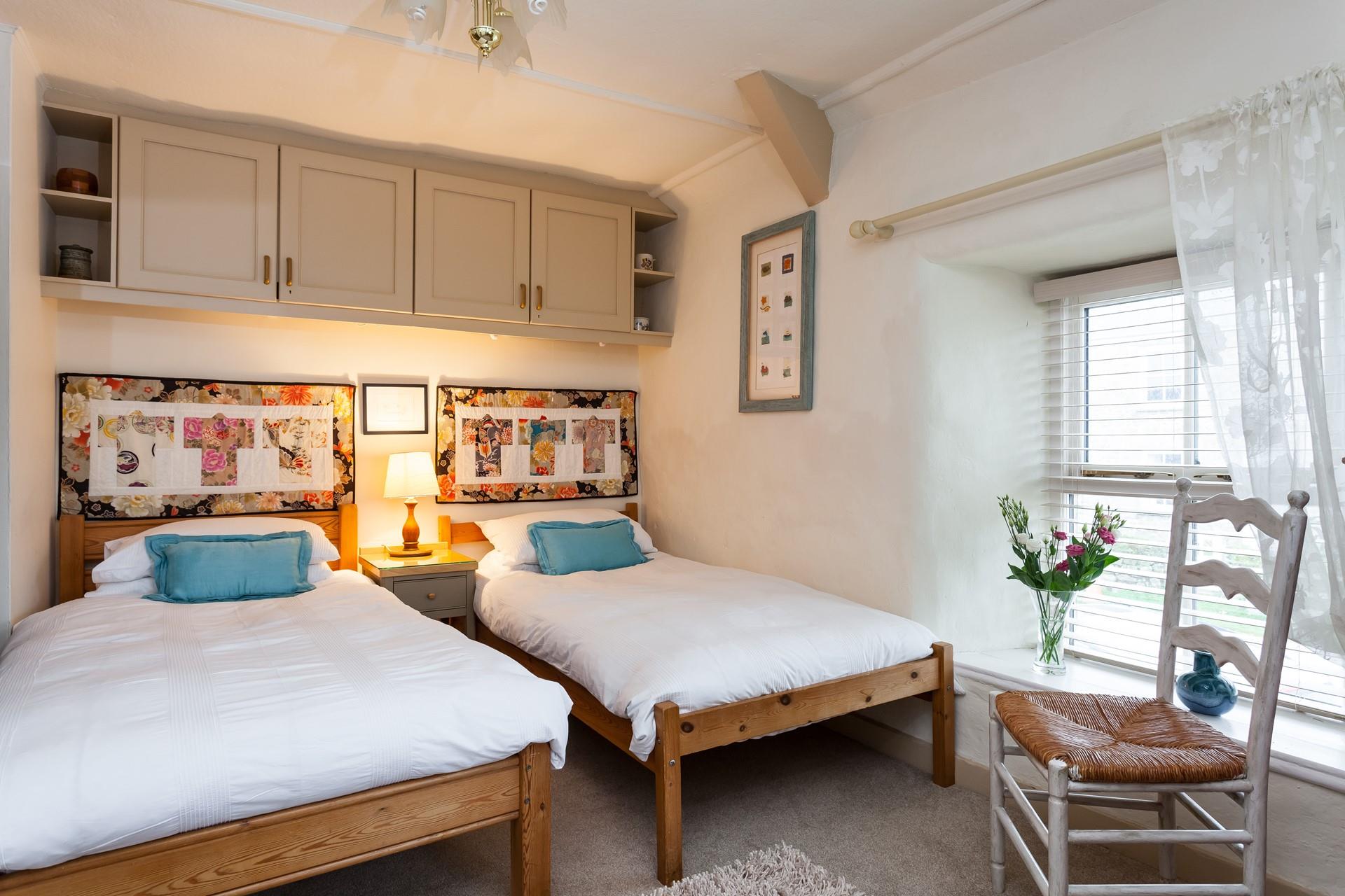 The cosy twin bedroom is the perfect space for the children to rest after busy days.