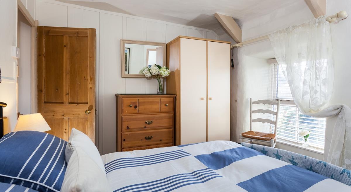 Plenty of storage for guests in the cosy, double bedroom.