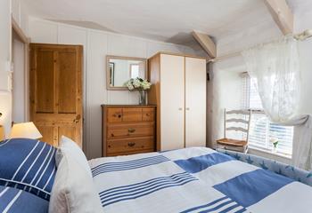 Plenty of storage for guests in the cosy, double bedroom.