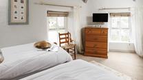 The twin bedroom is light and bright with dual aspect windows.