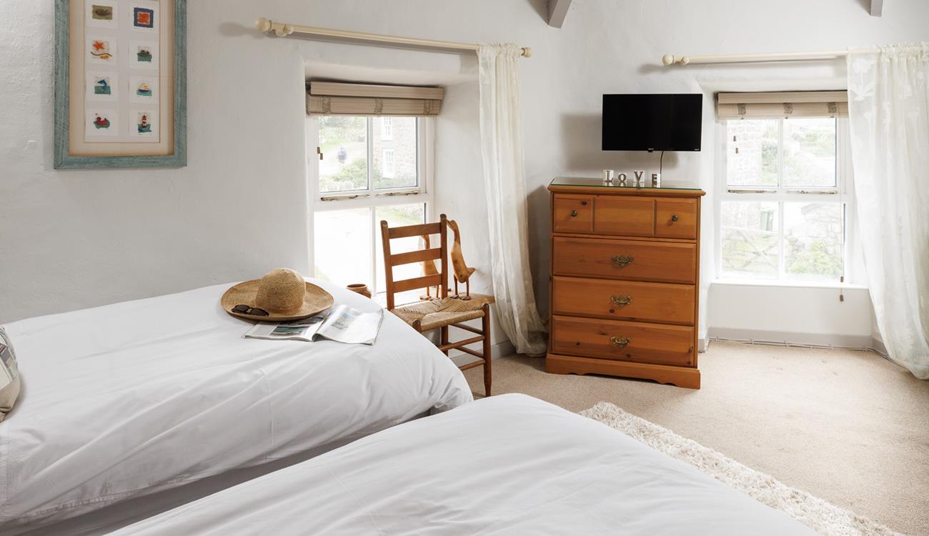 The twin bedroom is light and bright with dual aspect windows.