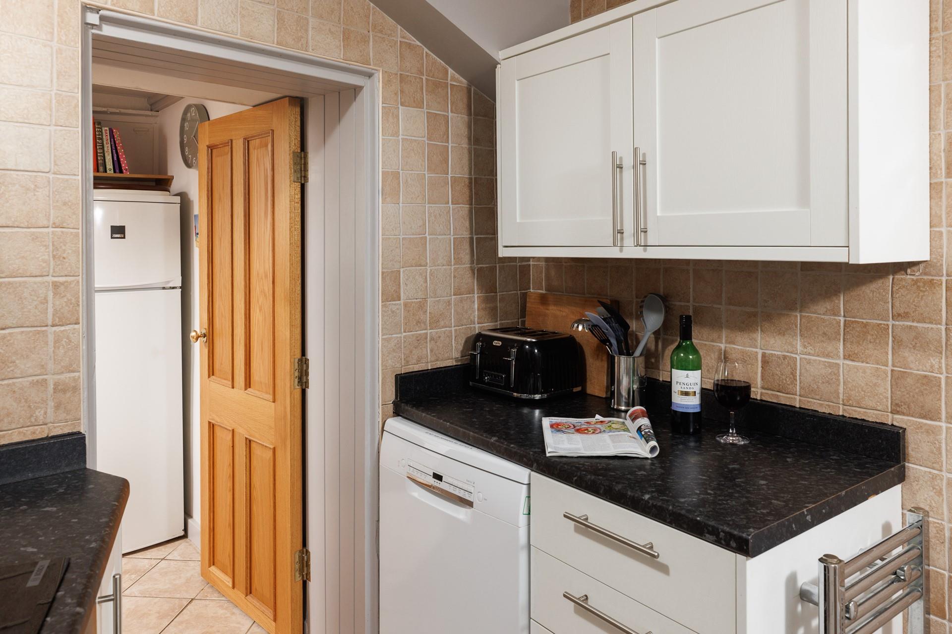 You can step from the kitchen through to the quaint patio garden.