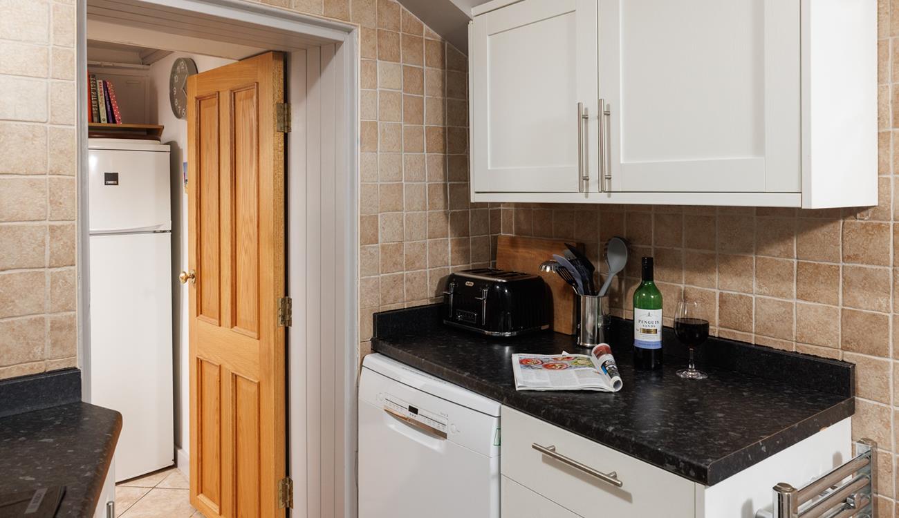 You can step from the kitchen through to the quaint patio garden.